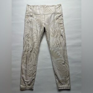 Athleta white and tan patterned leggings. Size L